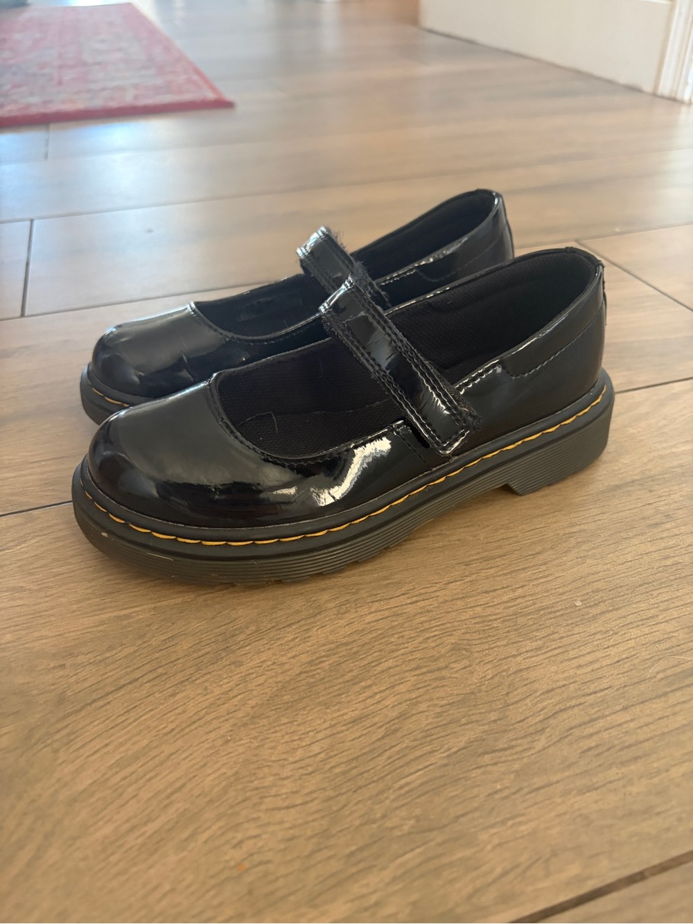 Dr. Martens Girls' Black Patent Mary Janes with Yellow Welt Stitching